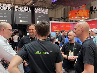 OMR 2023 with Ibexa and atlantis dx Photo: atlantis dx management in a circle at a meeting at OMR 2023